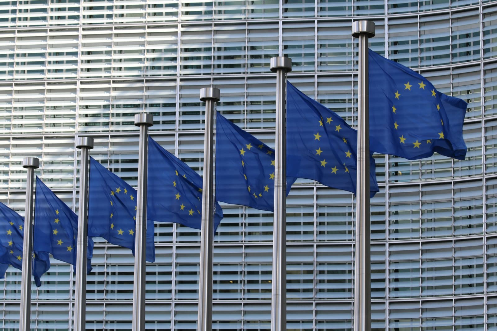 European Union flags wave in front of the European Commission headquarters in Brussels